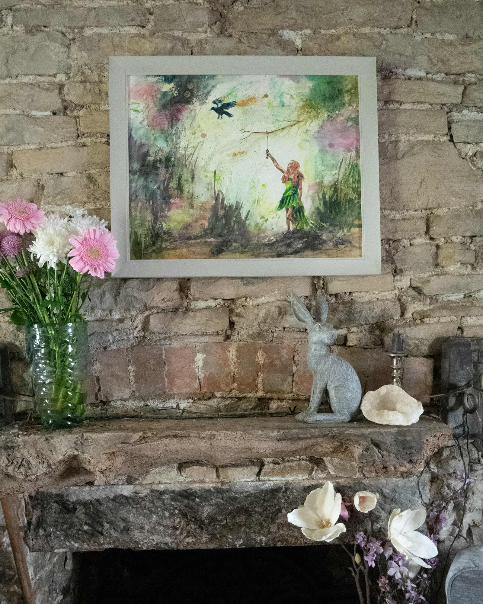 A contemporary painting in green and pink of a fairytale scene with a woman and a crow